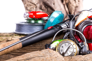 Fototapeta premium fishing tackles and fishing baits on wooden