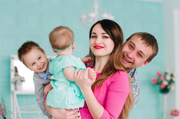 Beautiful family portrait spending time together at studio