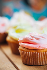 Sweet Gourmet Cupcake On Wooden Table