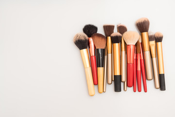 Set of decorative brush cosmetics on white background