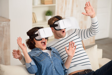 Pleasant couple using  virtual reality device