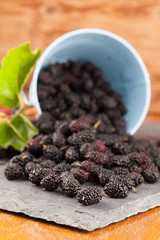Mulberries split on a slate board