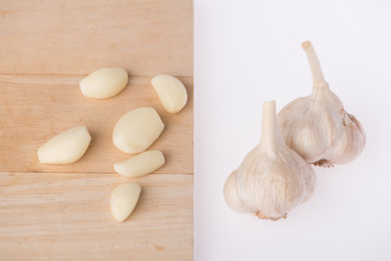Group garlic on wood white background