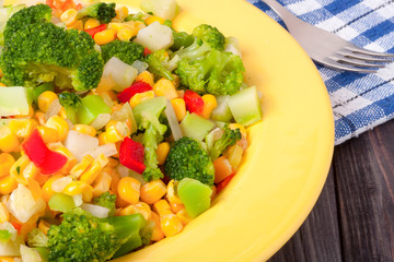 raw vegetable mix on the yellow plate