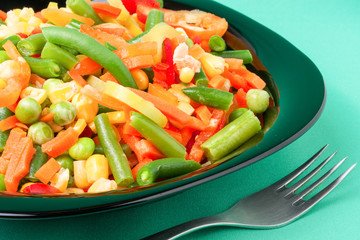 raw vegetable mix on the yellow plate