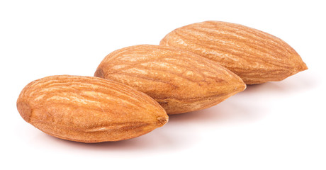 Three almonds isolated on white background macro