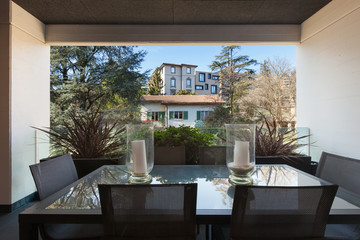 balcony with table and chairs