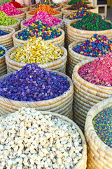 Selection of herbs and dry flowers on a traditional Moroccan market (souk) in Marrakech, Morocco