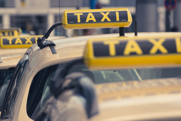  taxi signs, taxi cars waiting in queue