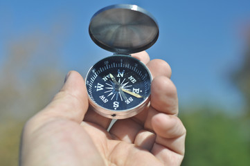 Compass in hand.