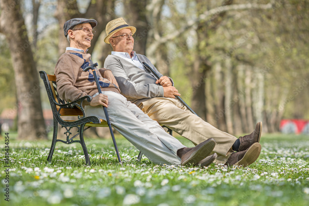 Sticker two seniors sitting and relaxing in a park