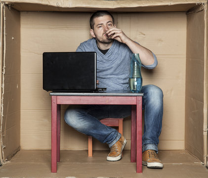 Young Intern Drink A Glass Of Alcohol At Work