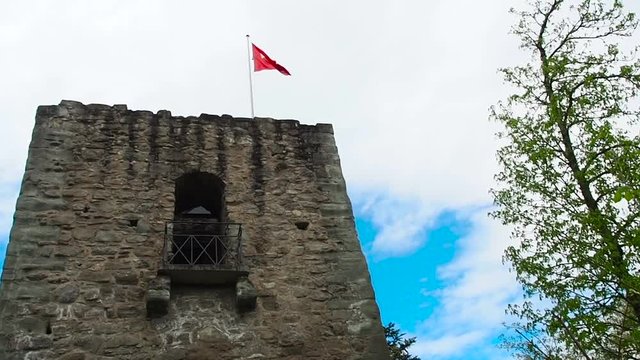 Swiss flag in the ruins of the old castle.