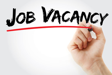 Hand writing Job Vacancy with marker, business concept background