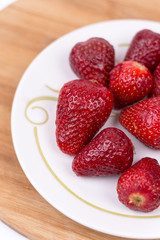 Aerial top view flat lay strawberries on the plate