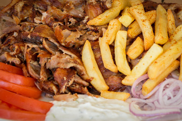 Greek gyros, meat, fried potatoes, tomatoes and onions, Athens Greece, national food, traditional Greek cuisine