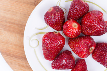 Aerial top view flat lay strawberries on the plate