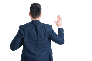 Back view of a lawyer swearing gesture