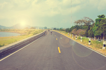 Cyclist riding bicycle in the morning