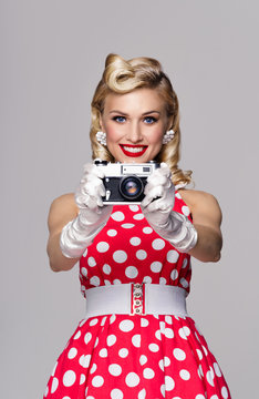 woman, with no-name camera, taking picture, dressed in pin-up st