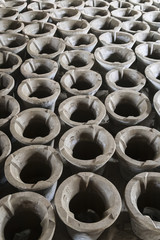 Rows of clay pots in artisan yard in a village near Battambang, Cambodia