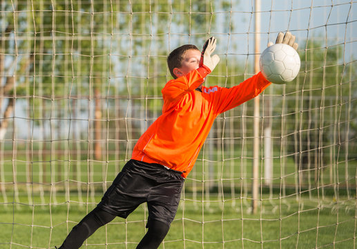 Boy Goalkeeper Defends