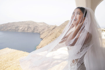 Fototapeta na wymiar Beautiful luxury bride on the balcony