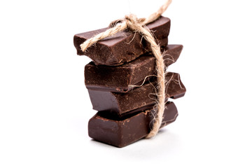 Dark chocolate stack, isolated on white , macro close up