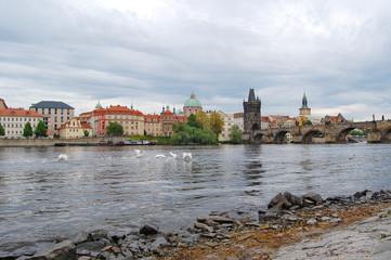 Fototapeta premium Prague. Old town. Spring.River Vltava. View from the bank to Charles Bridge.