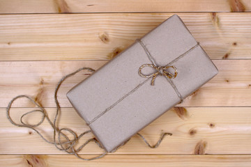 Wrapped gift box on wood background