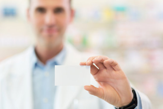 Pharmacist holding blank card
