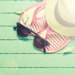 Summer concept with sandy beach, shells and cord.