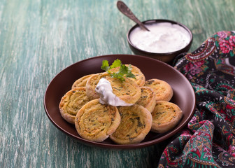 Indian potato rolls with yogurt sauce