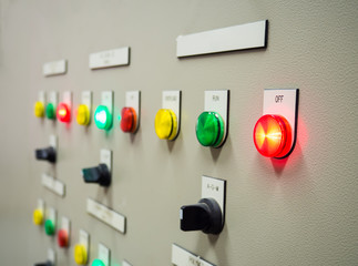 Group of status indicator light and selective switch of Auto-Manual on electrical control panel with blank name tag.Selective focus on OFF status light