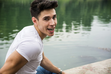 Dark-haired man looking at camera with open mouth