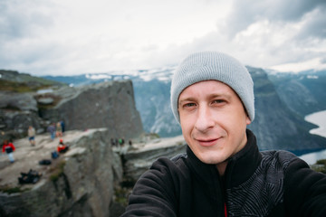 Young Tourist Taking Selfie Against The Backdrop Of The Norwegia