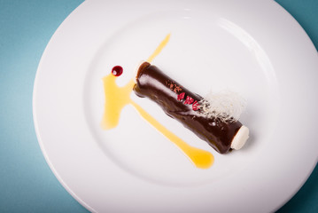 Haute cuisine dessert of chocolate with macarons.