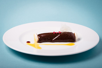 Haute cuisine dessert of chocolate with macarons.