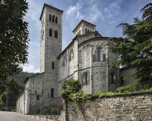 Fototapeta na wymiar Romanesque Basilica, Como, Italy: An exterior view of the rear of the 11th c. Roman Catholic Basilica di Sant'Abbondio in the town of Como, Italy