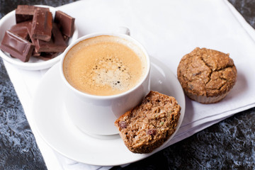 cup of coffee, chocolate and cakes, top view
