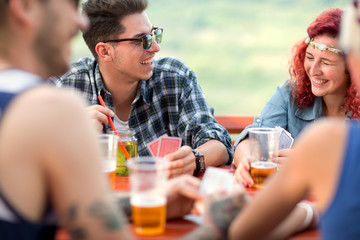 Curly girl and guy make jokes with friends