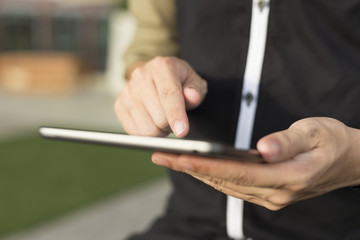 Man Typing a Tablet