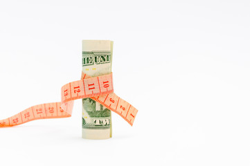 Compression of the budget of financing. Financial concept. Measurement of a banknote of twenty dollars ruler.