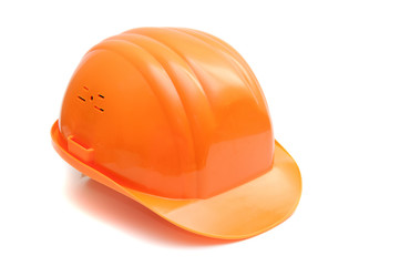 Fototapeta premium Builder plastic helmet orange color on white background. Isolated. 