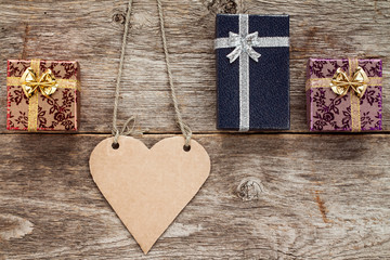 Heart shaped tag and three gift boxes