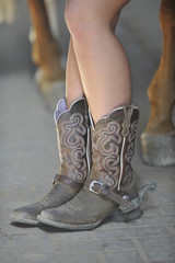 The closeup view of a rider brown leather boots