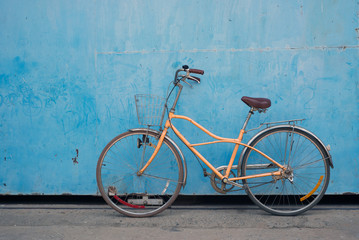 Vintage bicycle with old blue background