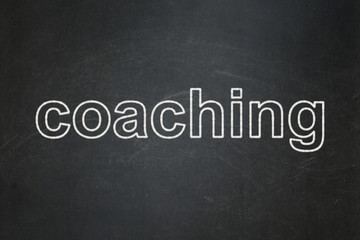 Learning concept: Coaching on chalkboard background
