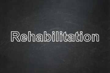 Obraz premium Medicine concept: Rehabilitation on chalkboard background