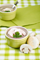 Mushroom ceam soup with bread with green tablecloth